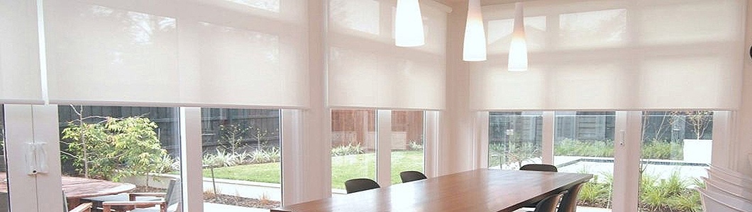 Living room with sunscreen blinds partially lowered